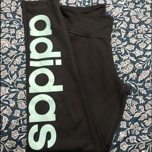 Dark grey Adidas with mint blue letters